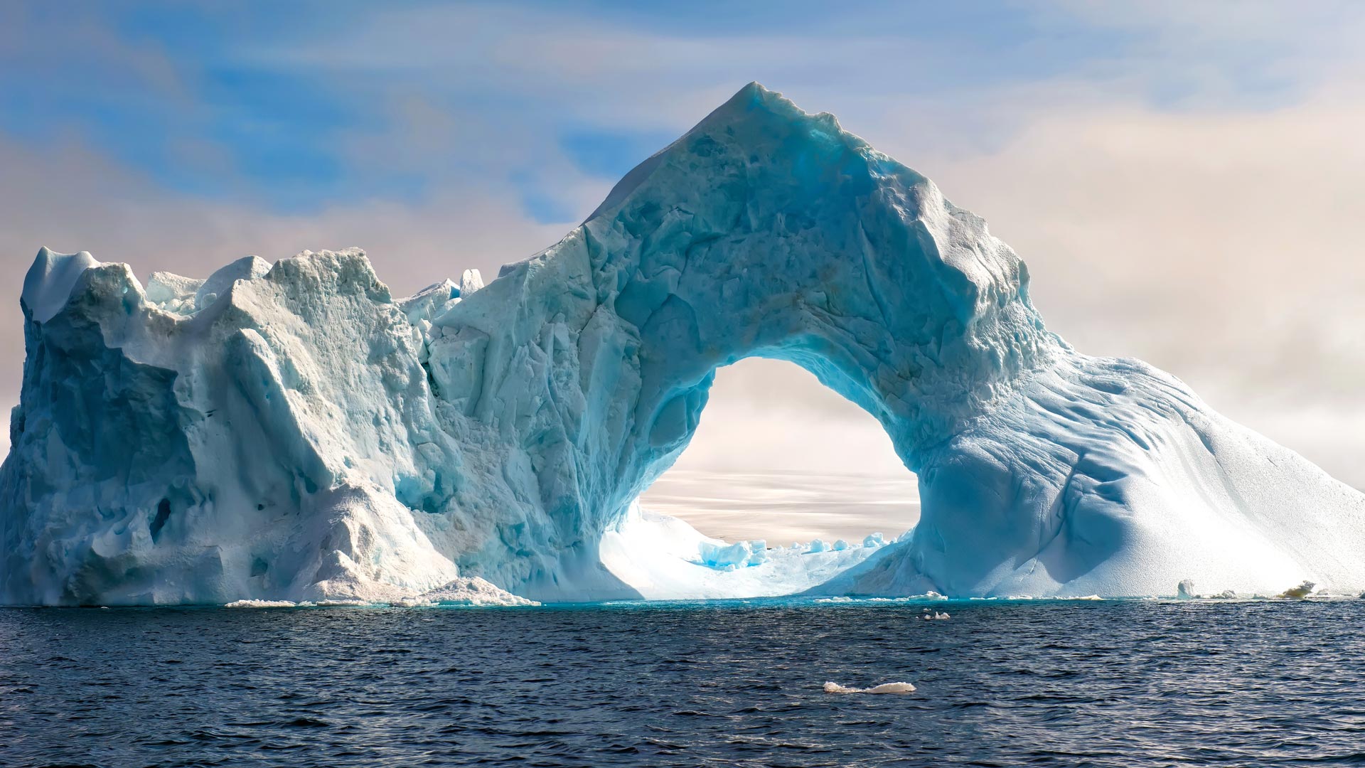 Bing HD Wallpaper Dec 1 2025 Natural Arch Carved In An Iceberg 