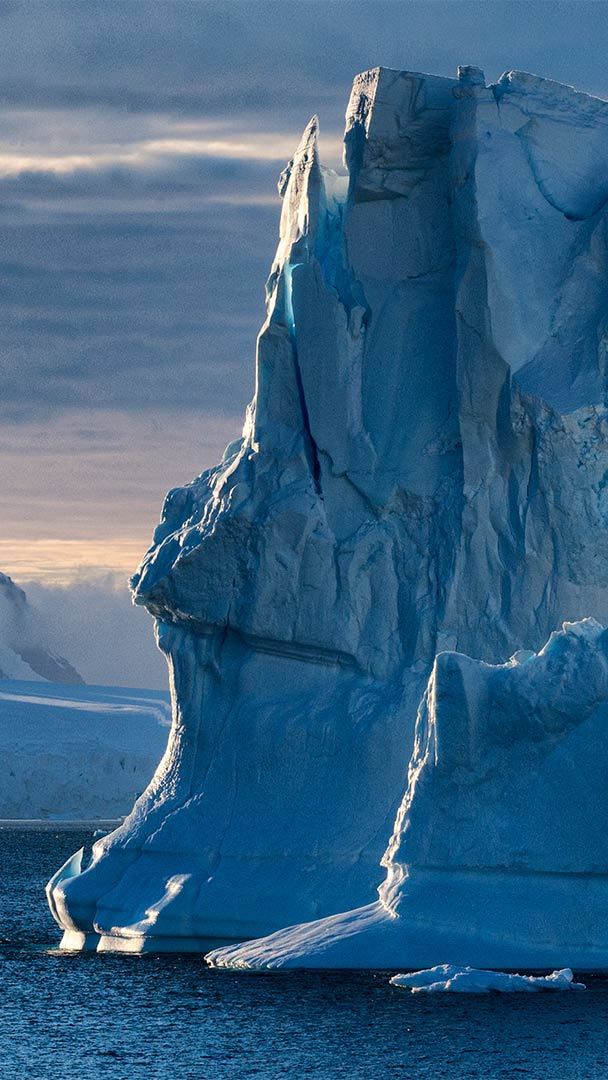 Antarctica Background, Icebergs In The Water Under A Cloudy Sky, Antarctica  Background Picture, Ice Background Image And Wallpaper for Free Download