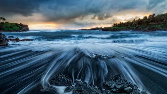 Black sands in a tropical paradise