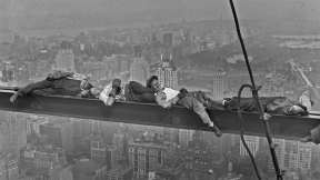 Construction workers resting above Manhattan