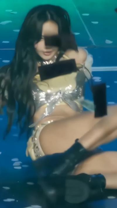 Close up shot of Lisa squirming on stage