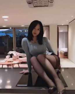 Young beautiful woman in sexy black stockings short MP4 video