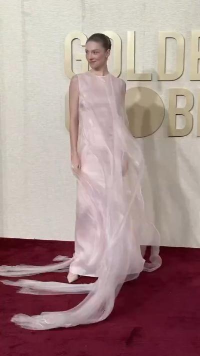 Hunter Schafer looks so beautiful in a pink dress with flying ribbons