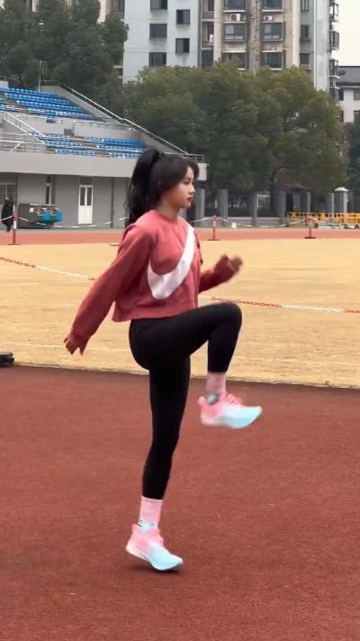 Girl exercising in the playground in the morning