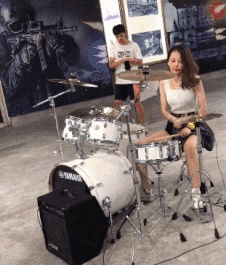 Beautiful women play drums
