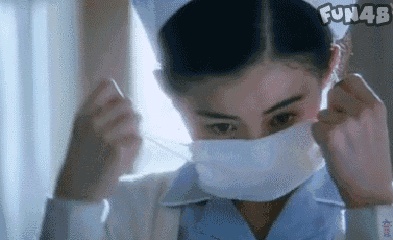 a beautiful nurse remove her mask