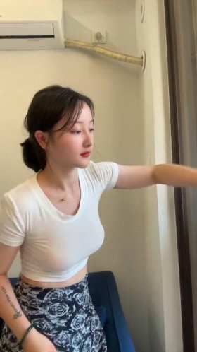 Young woman cleaning the glass short MP4 video