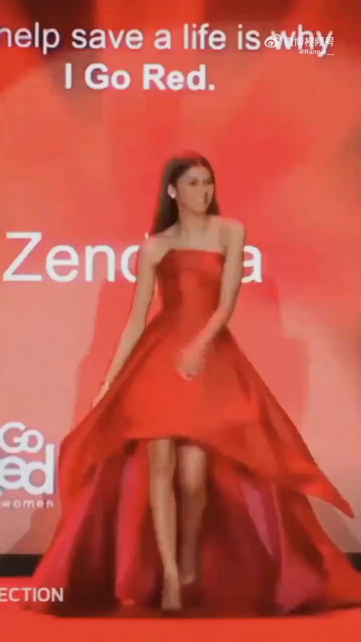 Zendaya is wearing a red dress, like a walking rose