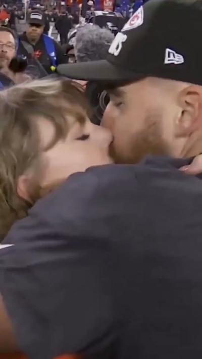 Taylor Swift kisses and hugs boyfriend Travis Kelce in the stadium crowd