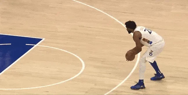 Embiid dribbled behind his back and accidentally bounced the ball off his head. GIF
