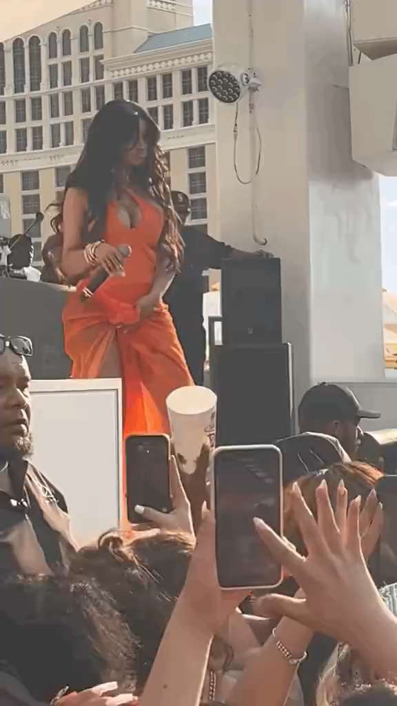 Cardi B hits back with a mic when she is splashed with a drink
