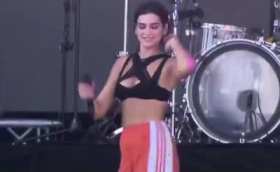 Dua Lipa performs classic cigarette dance during "One Kiss" short MP4 video