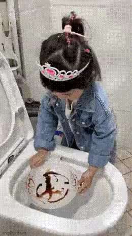 Little girl discovers automatic dishwasher GIF