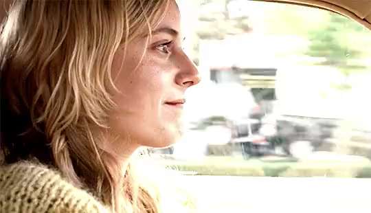 Greta Gerwig as Florence Marr, driving