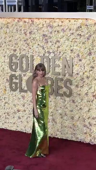 Taylor Swift wears green sequined dress at 2024 Golden Globe Awards