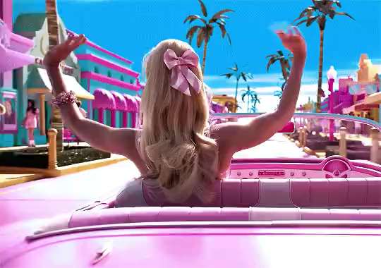 Barbie waving in convertible