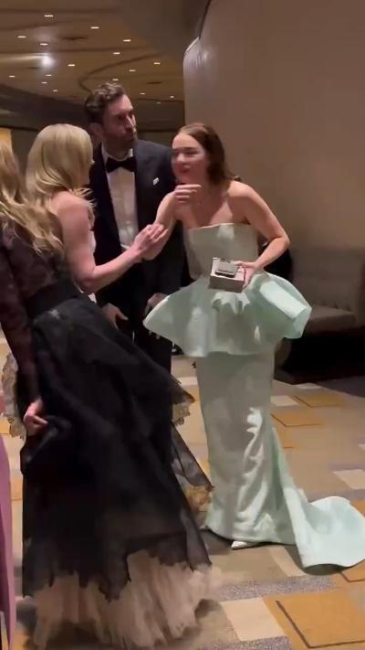 Emma Stone jogs excitedly after hearing "Poor Things" won the award