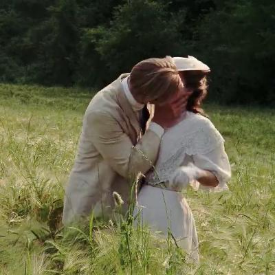 Kissing in the wheat field GIF