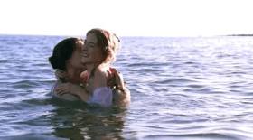 Ammonite Kate Winslet Saoirse Ronan play in the water GIF