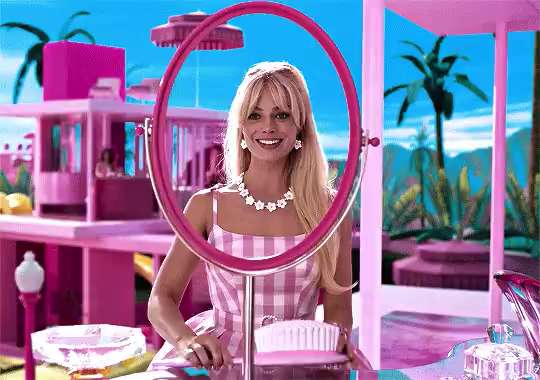 Barbie in front of the mirror, like a camgirl