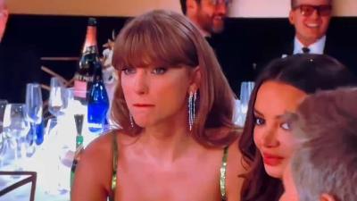 Taylor Swift drinks champagne