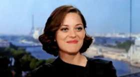 Marion Cotillard's shy and secretly happy expression GIF