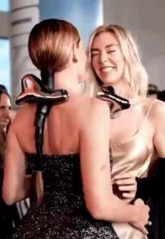 Rebecca Ferguson and Vanessa Kirby hug and kiss short MP4 video