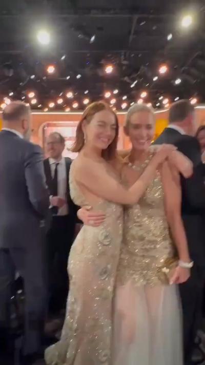 Emma Stone and Emily Blunt hugging face-to-face