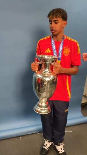 Spain won the European Championship, and two players played rock paper scissors while lifting the trophy short MP4 video