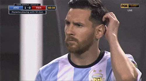 Messi scratches his head with a disgusted expression