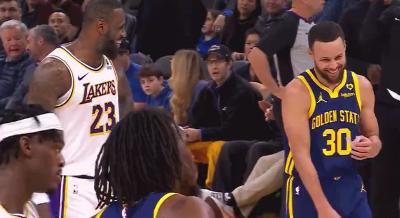 LeBron James and Stephen Curry chatting and laughing