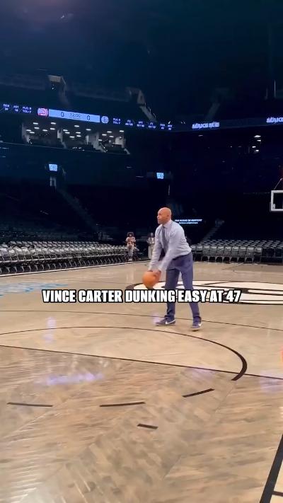 Vince Carter dunks in shirt and tie