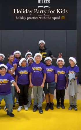 Lakers player Vanderbilt poses with children wearing Santa hats short MP4 video
