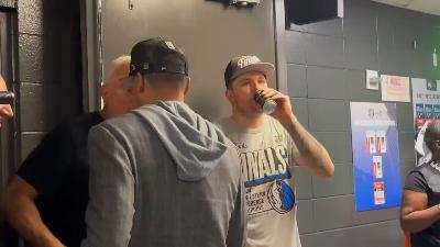 Doncic drinks beer after the game, but Michael Finley takes it away