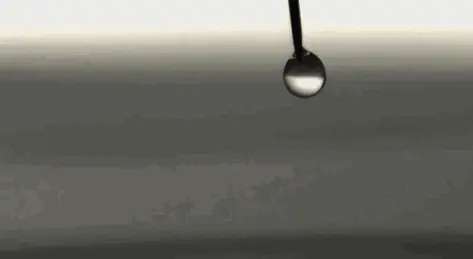 High-speed footage captures water droplets falling into water
