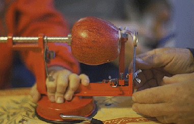 Sewing machine peeling apples GIF