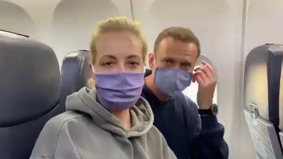 Alexei Navalny and his wife record video on a plane in 2021