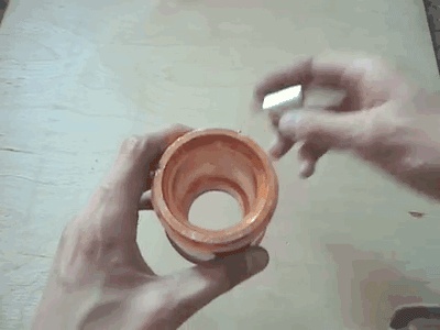 The magnet passes through the copper cast tube